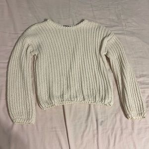 White knit sweater.